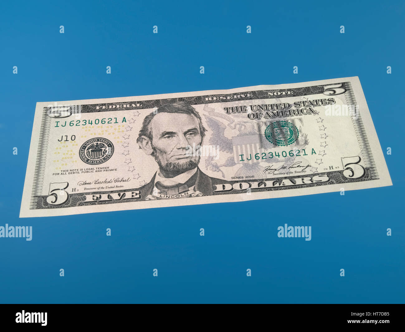 Isolated 5 dollar bill Stock Photo