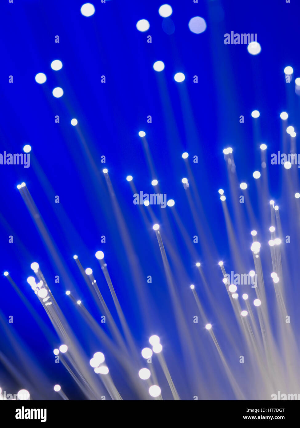 Fibre Optic cable with a Blue Background Stock Photo - Alamy
