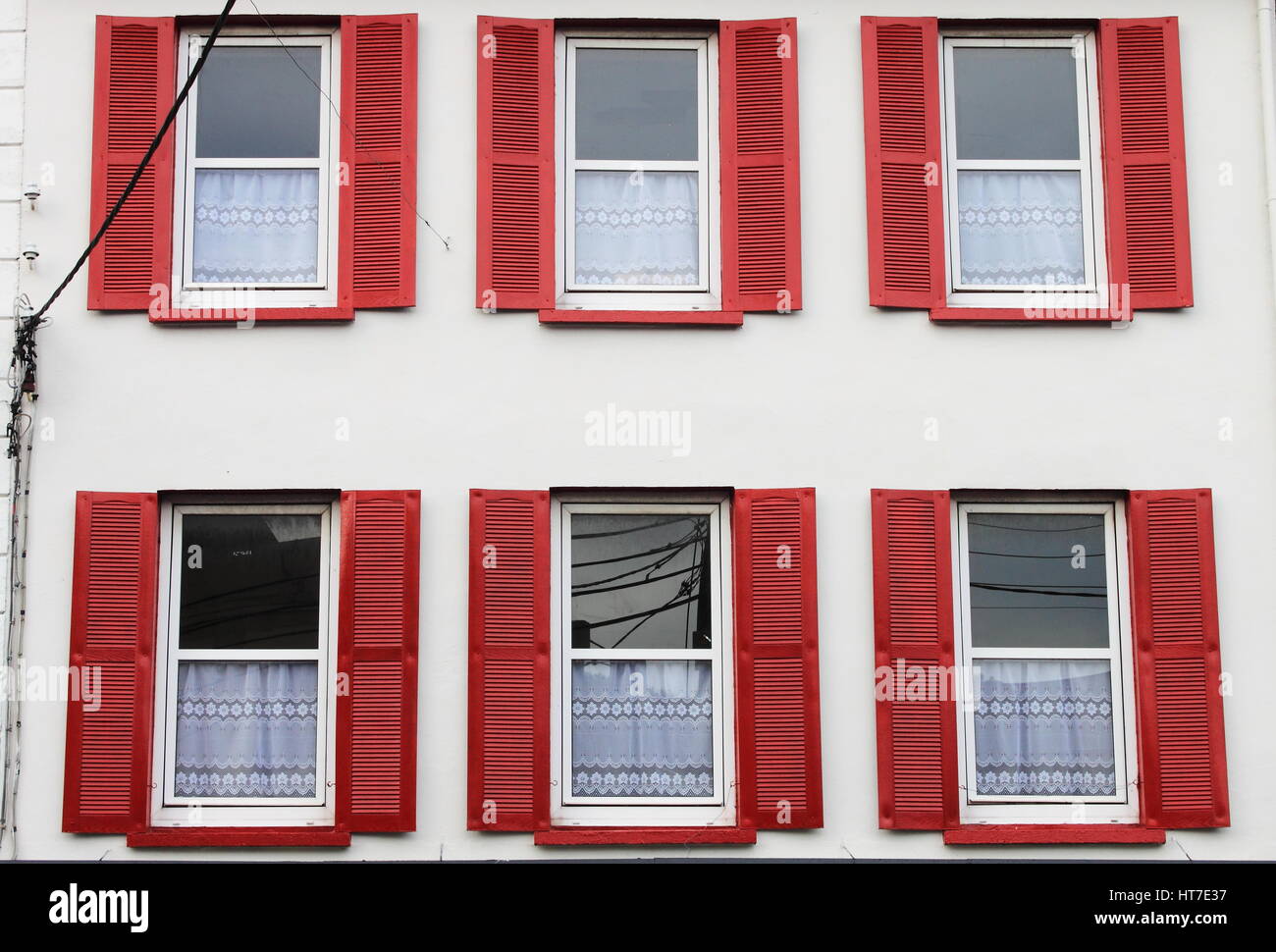 Open Window Inside Red Building with red windows and open shutters Stock Photo - Alamy