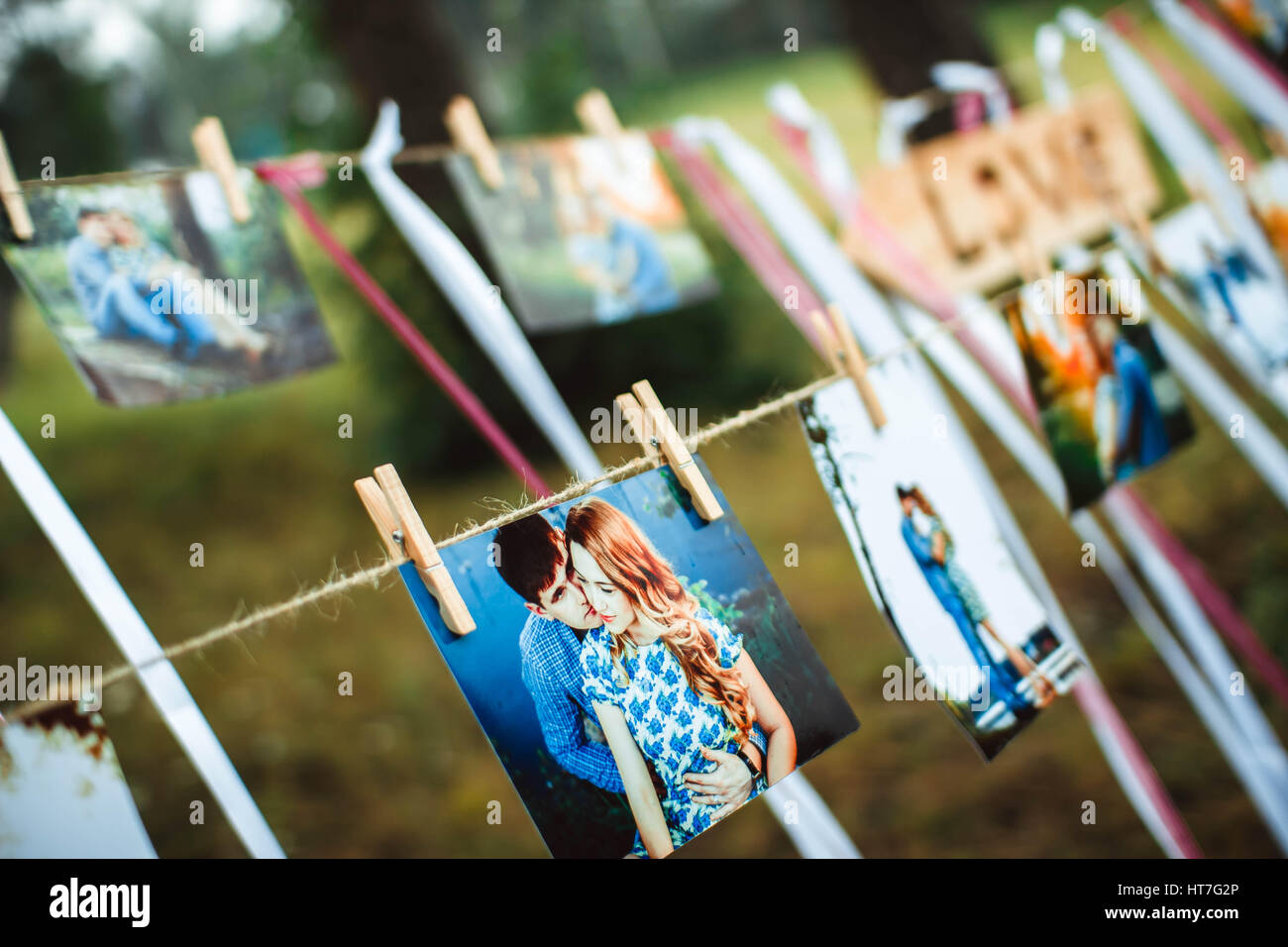 photos of lovers hanging on a rope outdoors Stock Photo