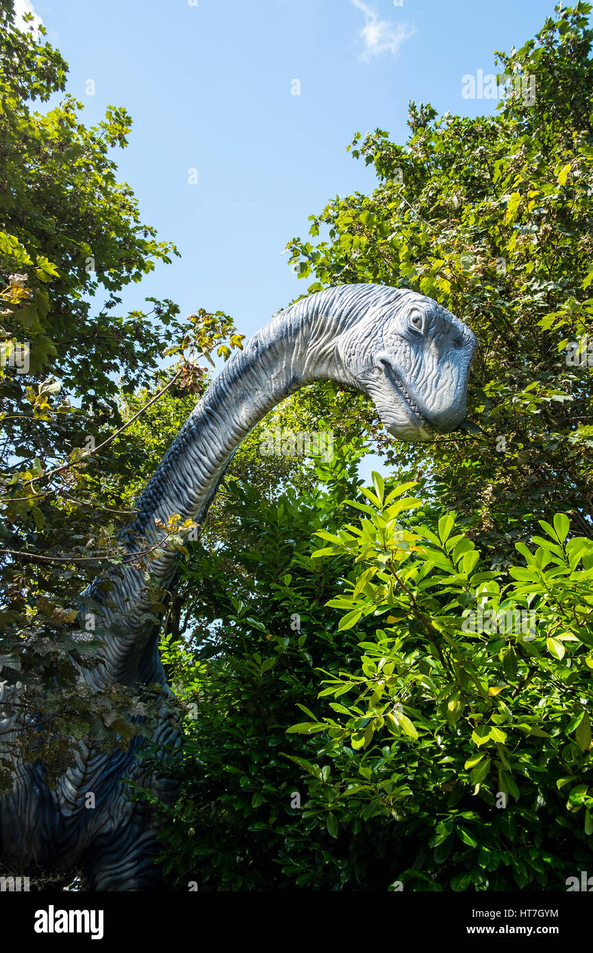 Dinosaur eating from trees at Dan yr Ogof caves number 3623 Stock Photo