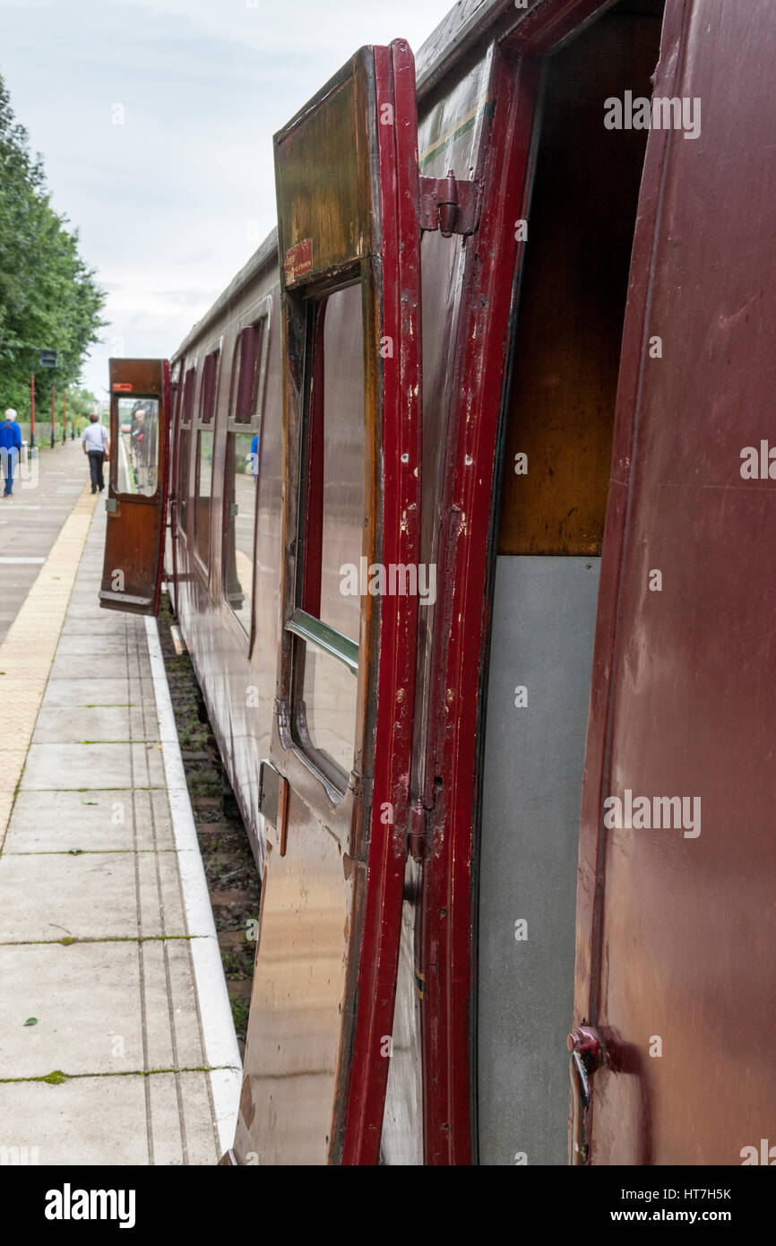 Open doors on old British Railways train carriages at Ruddington Fields heritage railway station platform, Nottinghamshire, England, UK Stock Photo