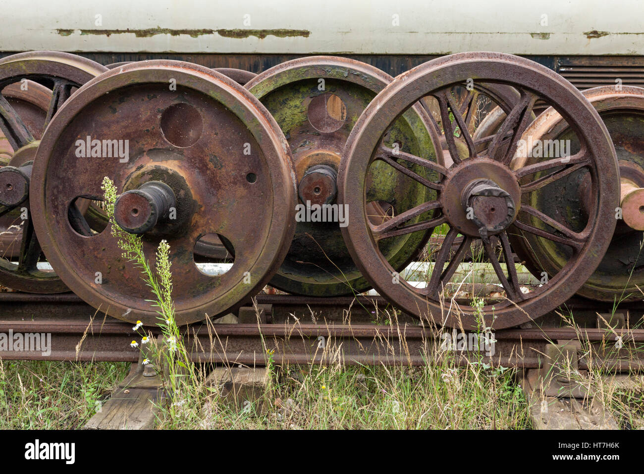 Old railway wheels (wheelsets) for a train carriage, locomotive or other rolling stock, Ruddington, Nottinghamshire, England, UK Stock Photo