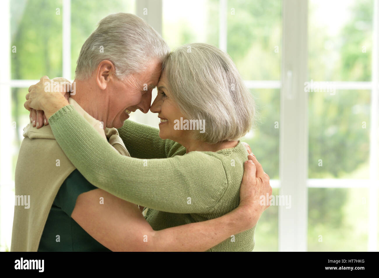 Happy elderly couple embracing Stock Photo