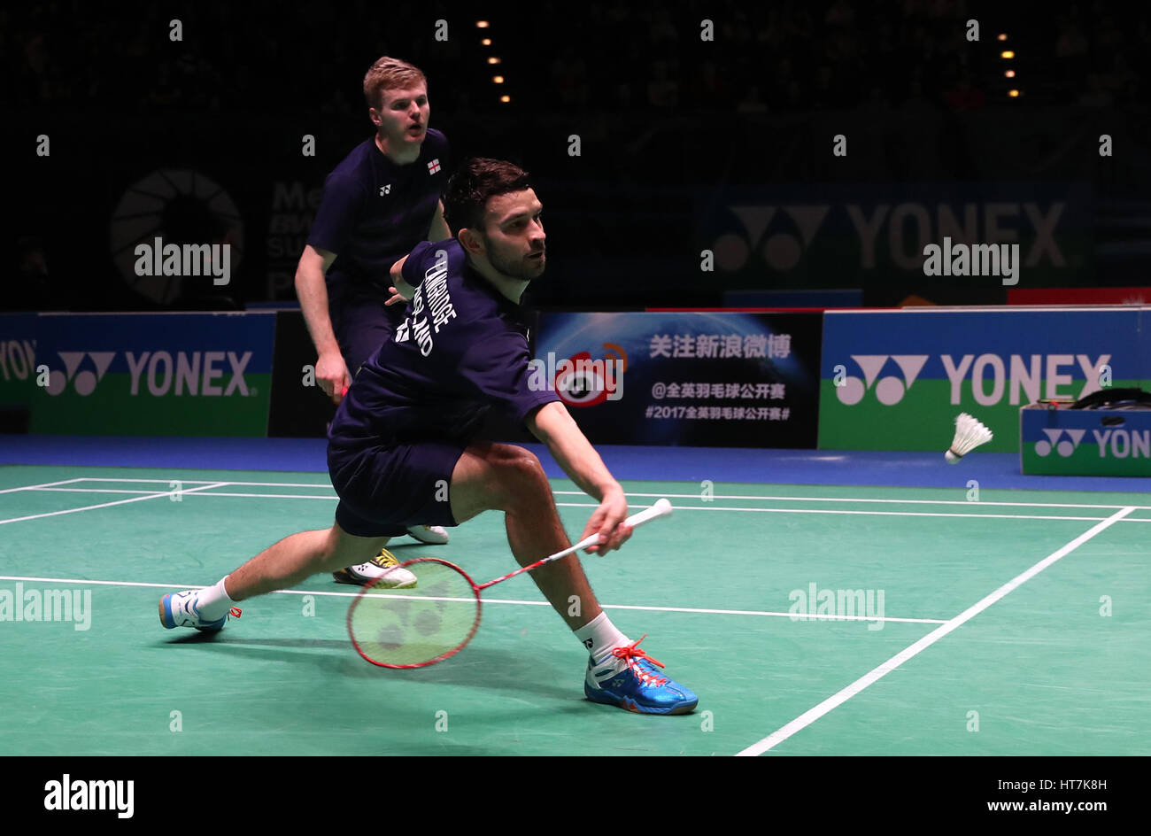 England's Chris Langridge (front) Marcus Ellis in action during the Men's doubles match during day two of the YONEX All England Open Badminton Championships at the Barclaycard Arena, Birmingham. Stock Photo