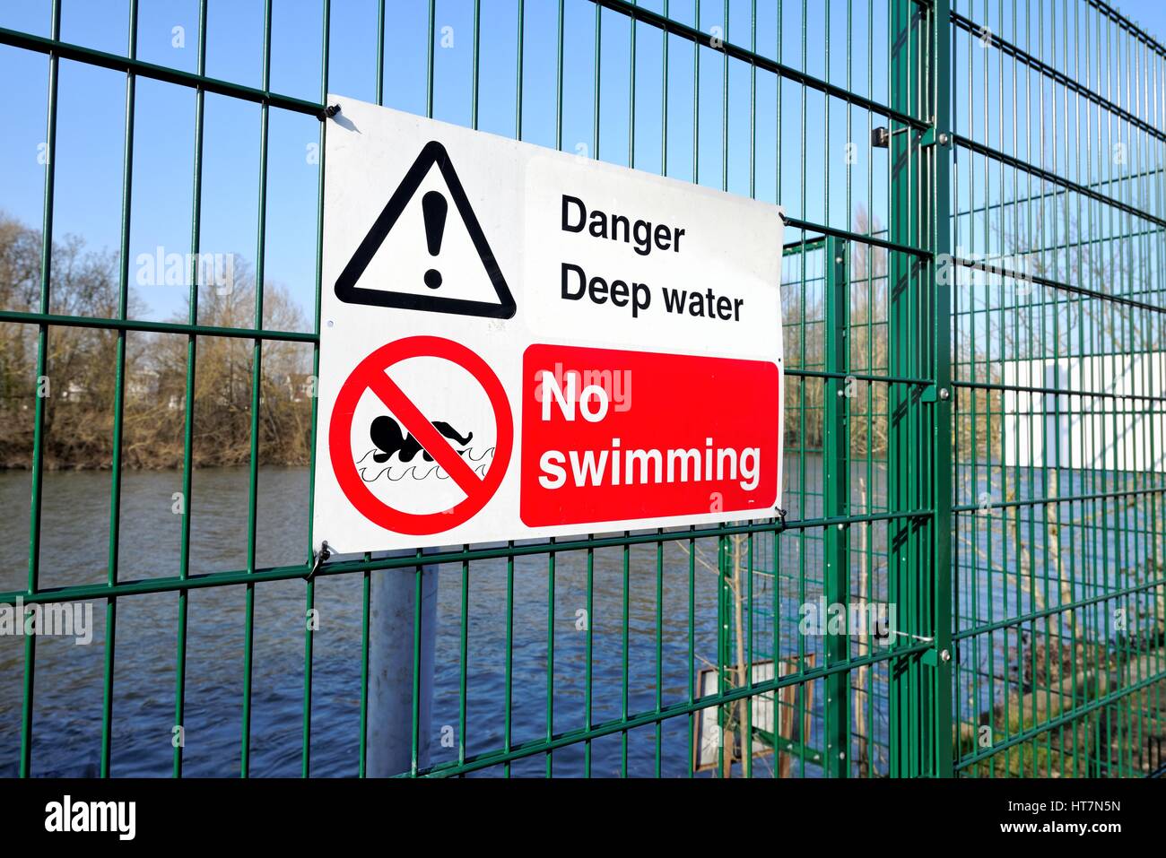 No Swimming sign on a fencing by river Thames west London UK Stock Photo