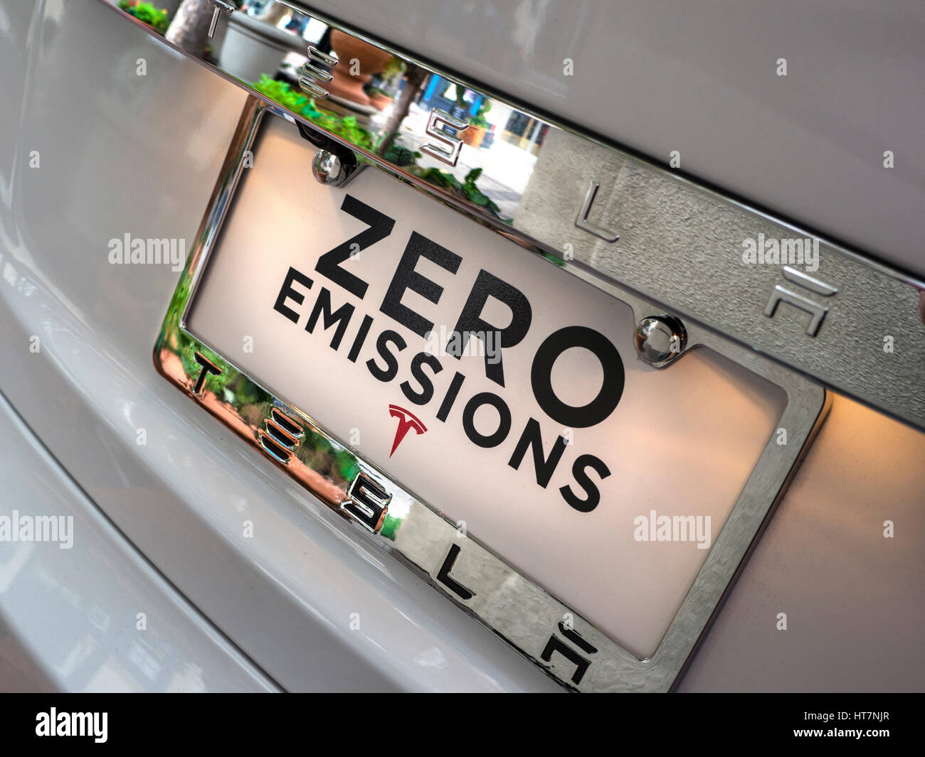 TESLA Zero emissions display plate on latest Tesla an all electric powered stylish sports car with around 300 miles range per charge Stock Photo