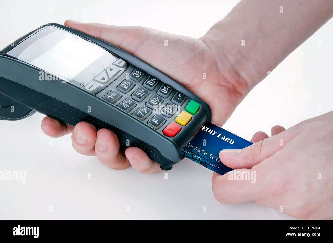 Hand with credit card swipe through terminal for sale Stock Photo Alamy