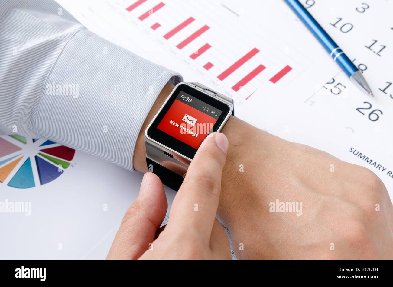 Man working with smart watch in office. New message received notification on screen Stock Photo