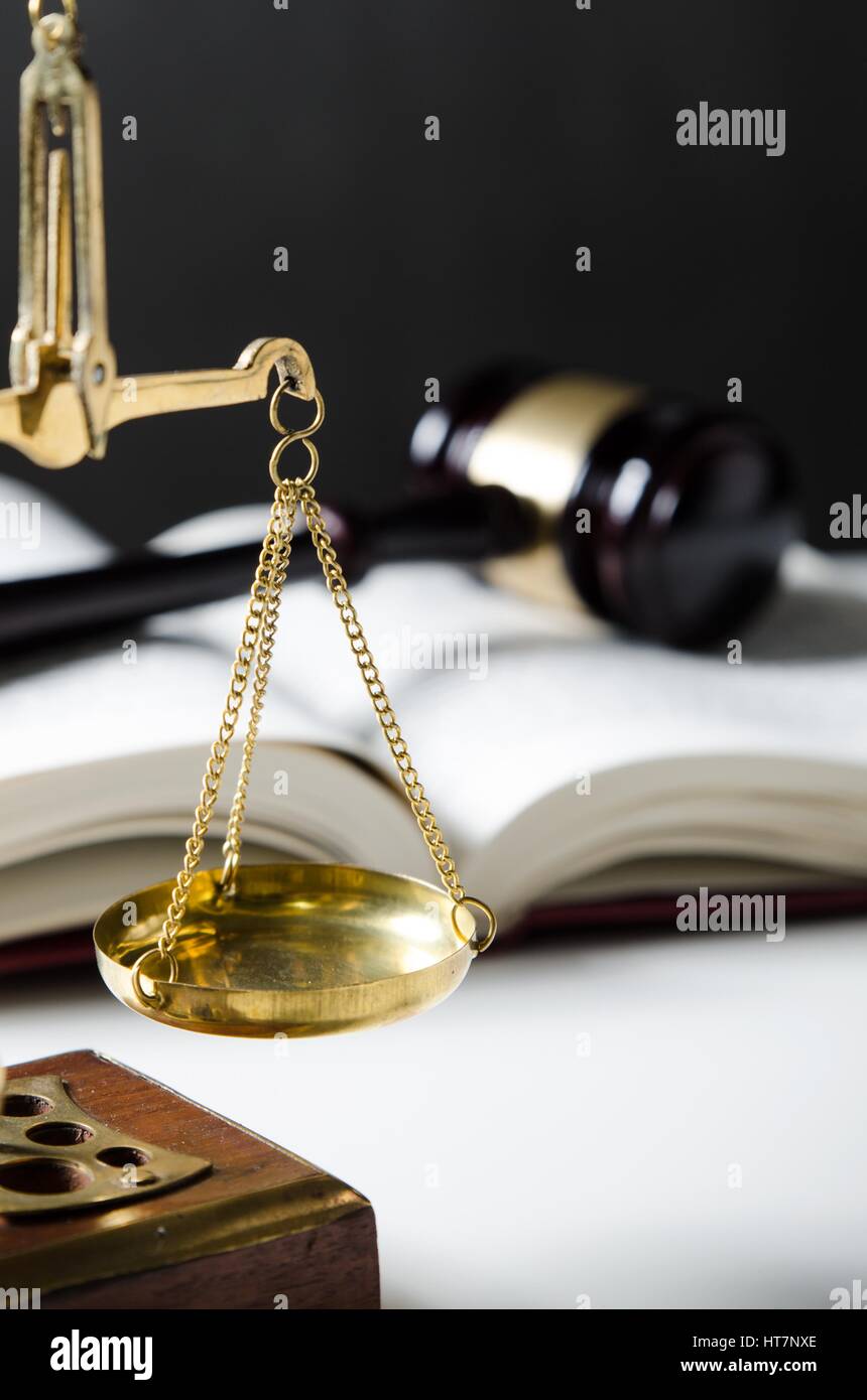 Scale of Justice. Law composition with gavel on books in background Stock Photo