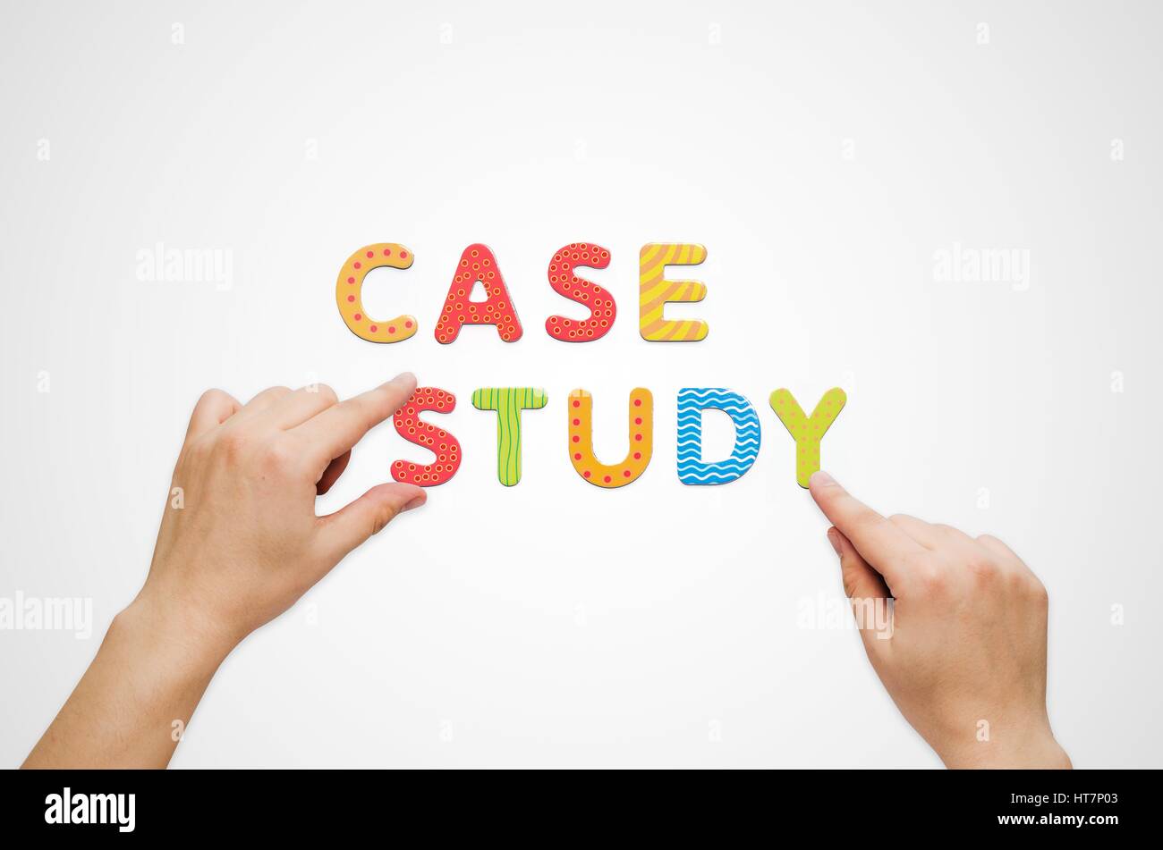 Hands put the words Case Study with magnetic letters. Colorful alphabet kit Stock Photo