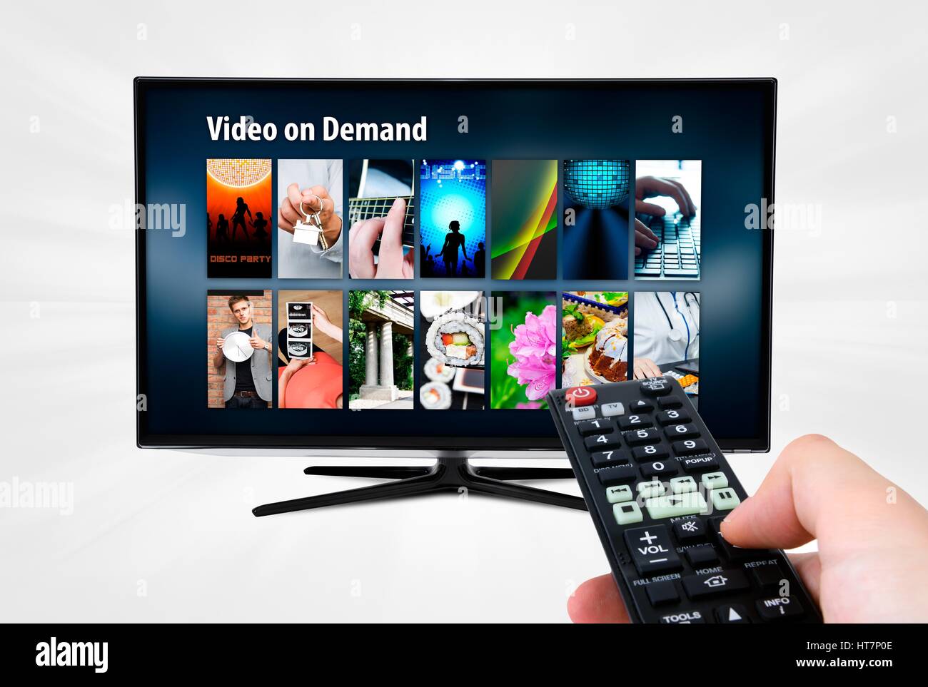 Video on demand VOD service on smart TV. Remote control in hand Stock Photo  - Alamy