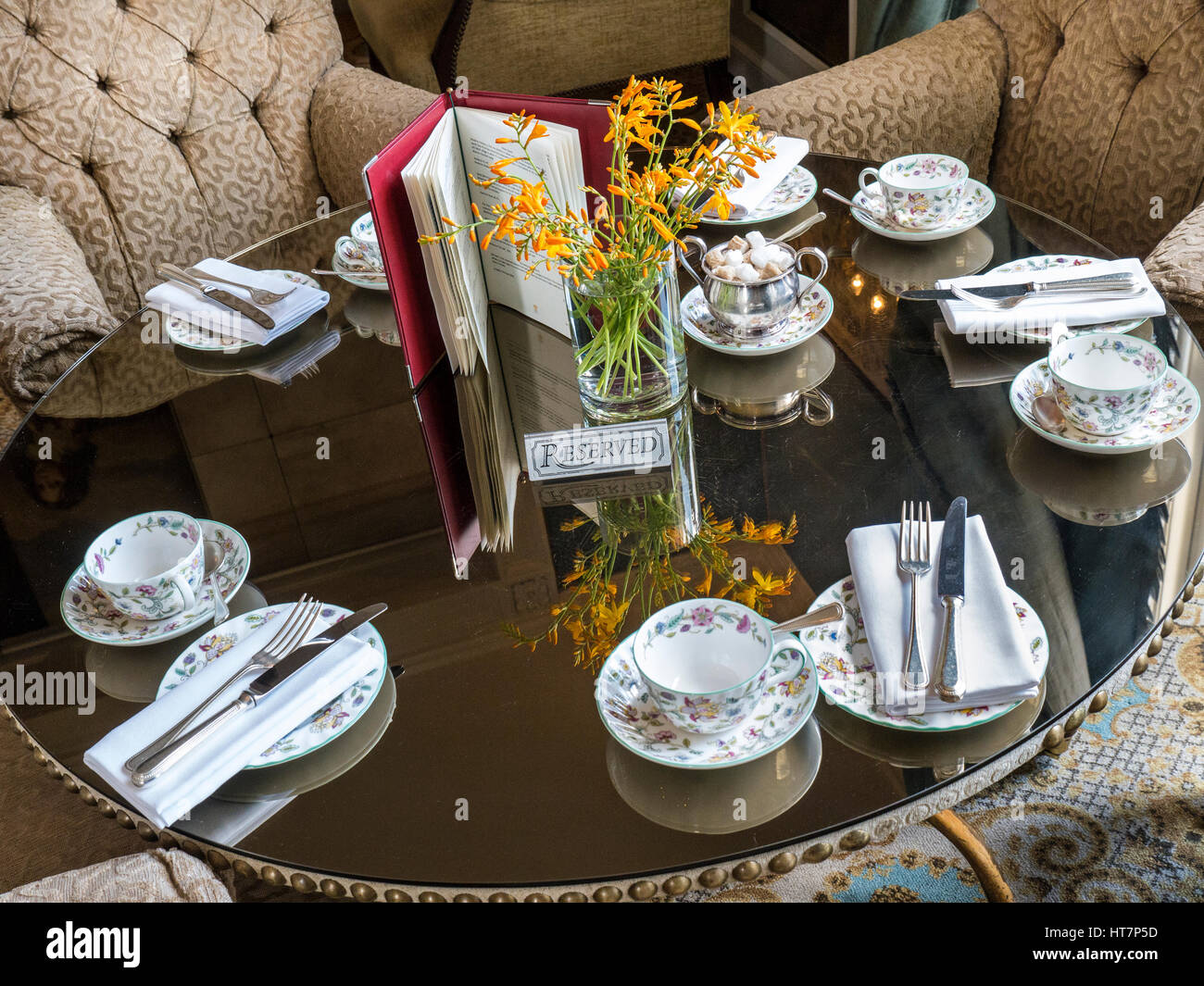 Relais & Chateaux Hotel restaurant table with reserved sign, laid for traditional English afternoon tea Stock Photo