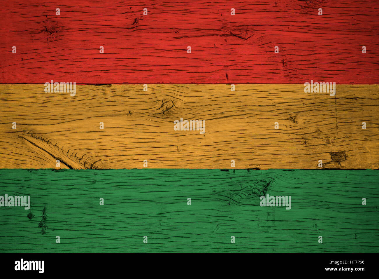 Bolivia civil flag painted on old oak wood. Painting is colorful on planks of old train carriage. Stock Photo
