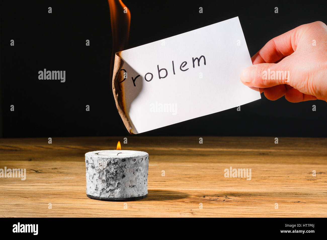 Concept for solution to problem by burning paper with text problem Stock Photo