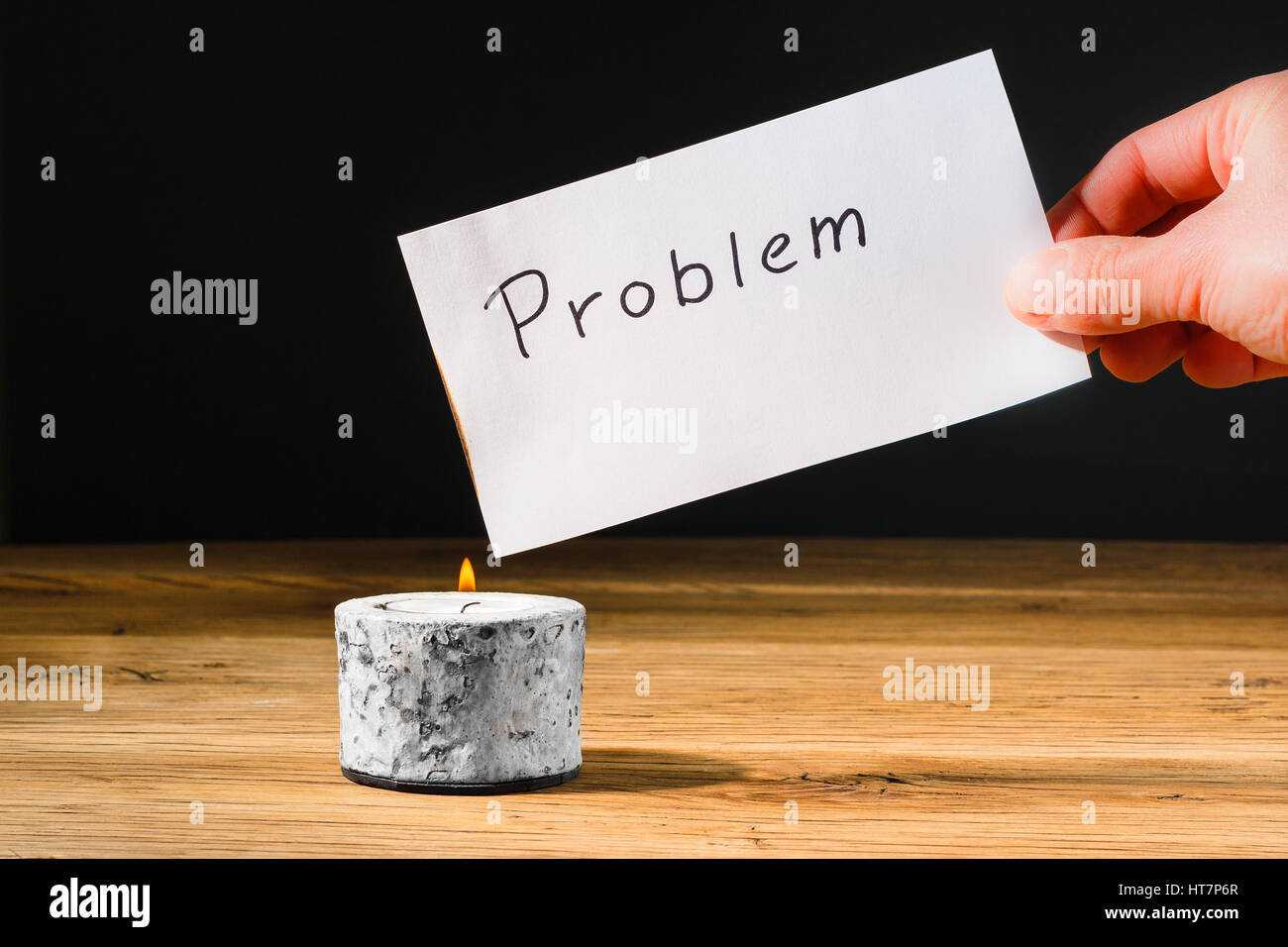 Concept for solving or letting problem disappear by burning paper with text problem Stock Photo