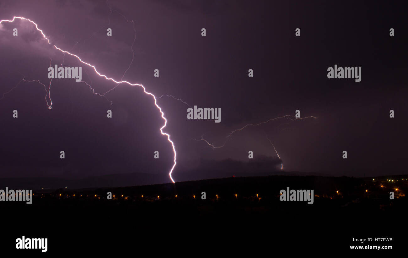 Lightning above city Stock Photo