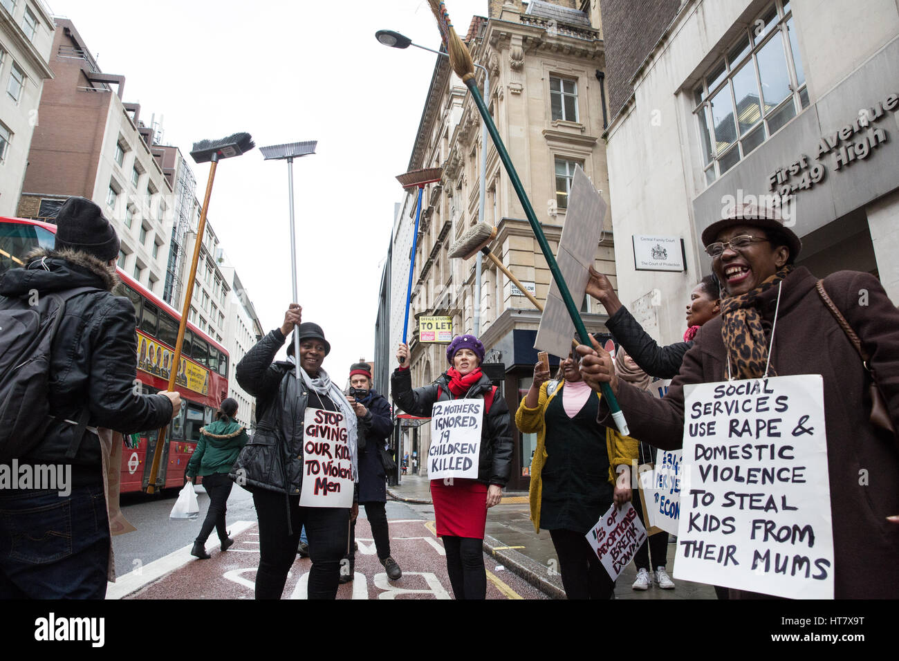 London, UK. 8th Mar, 2017. Women from Global Women's Strike and Women's Strike UK sweep the street as part of a protest for the world's mothers and children outside the Central Family Court in Holborn on International Women's Day and as part of an International Women's Strike. Brooms have been adopted as a symbol by women in the UK on the basis that brooms are strong when all strands work together. Credit: Mark Kerrison/Alamy Live News Stock Photo