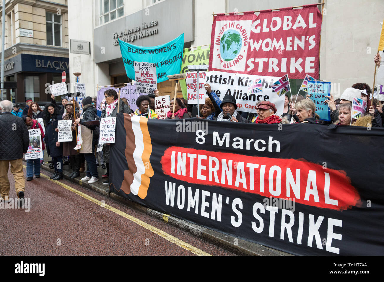 London, UK. 8th Mar, 2017. Women from Global Women's Strike and Women's Strike UK protest for the world's mothers and children outside the Central Family Court in Holborn on International Women's Day and as part of an International Women's Strike. Some women hold brooms, adopted as a symbol by women in the UK on the basis that brooms are strong when all strands work together. Credit: Mark Kerrison/Alamy Live News Stock Photo