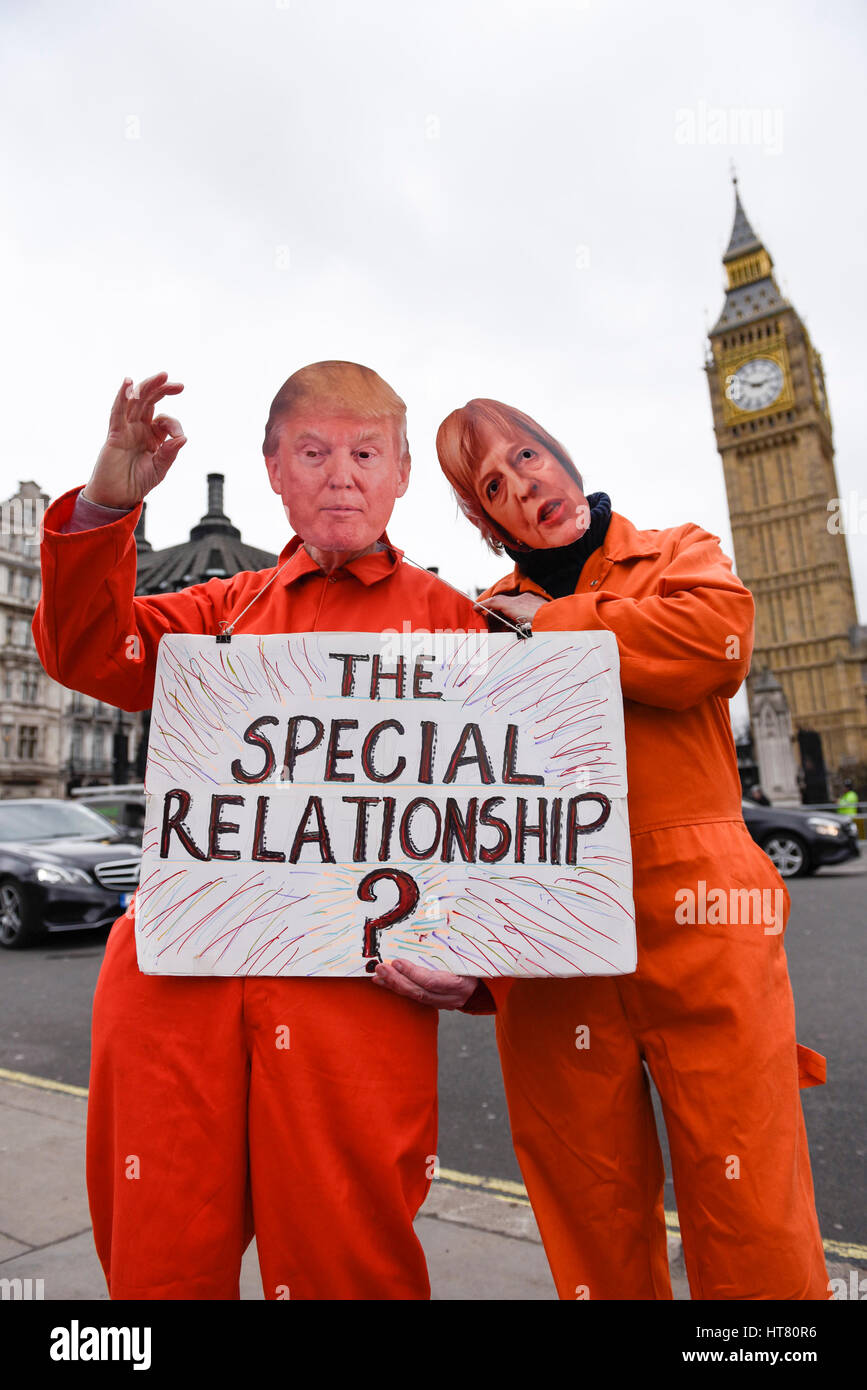 London, UK.  8 March 2017.  Members of Guantanamo Justice Campaign, wearing Donald Trump and Theresa May masks, take part in a protest in Parliament Square opposite the Houses of Parliament demanding that Donald Trump, President of the United States, close Guantanamo Bay concentration camp and calling on Theresa May, Prime Minister, to seek representations from President Trump that it will be a closure, not a relocation to a mainland US prison.  Credit: Stephen Chung / Alamy Live News Stock Photo