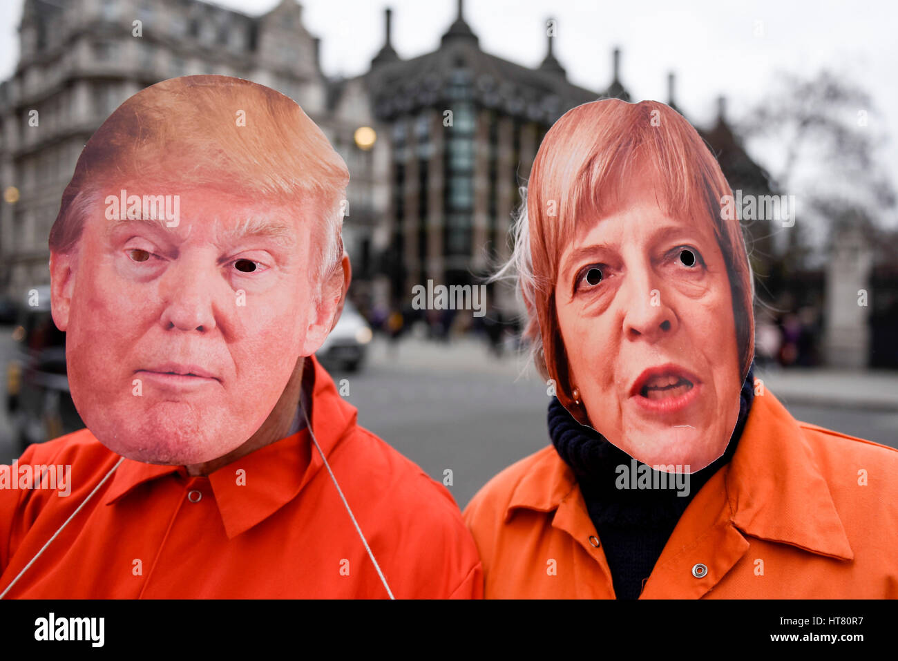 London, UK.  8 March 2017.  Members of Guantanamo Justice Campaign, wearing Donald Trump and Theresa May masks, take part in a protest in Parliament Square opposite the Houses of Parliament demanding that Donald Trump, President of the United States, close Guantanamo Bay concentration camp and calling on Theresa May, Prime Minister, to seek representations from President Trump that it will be a closure, not a relocation to a mainland US prison.  Credit: Stephen Chung / Alamy Live News Stock Photo