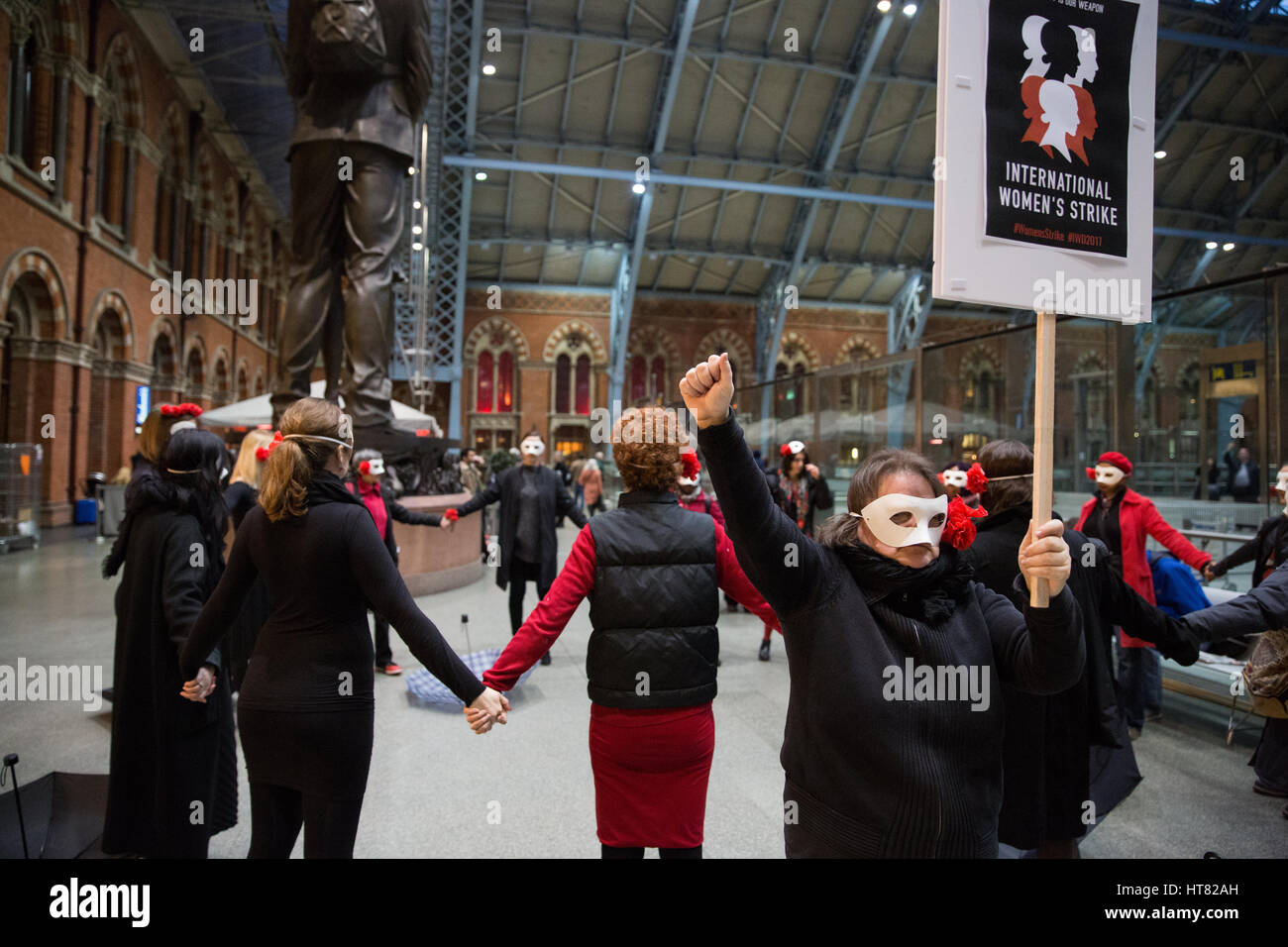 London, UK. 8th March, 2017. Women from Global Women's Strike, Women's Strike UK and Polish feminists stage  performance art at St Pancras station to coincide with International Women's Day and the International Women's Strike. Credit: Mark Kerrison/Alamy Live News Stock Photo