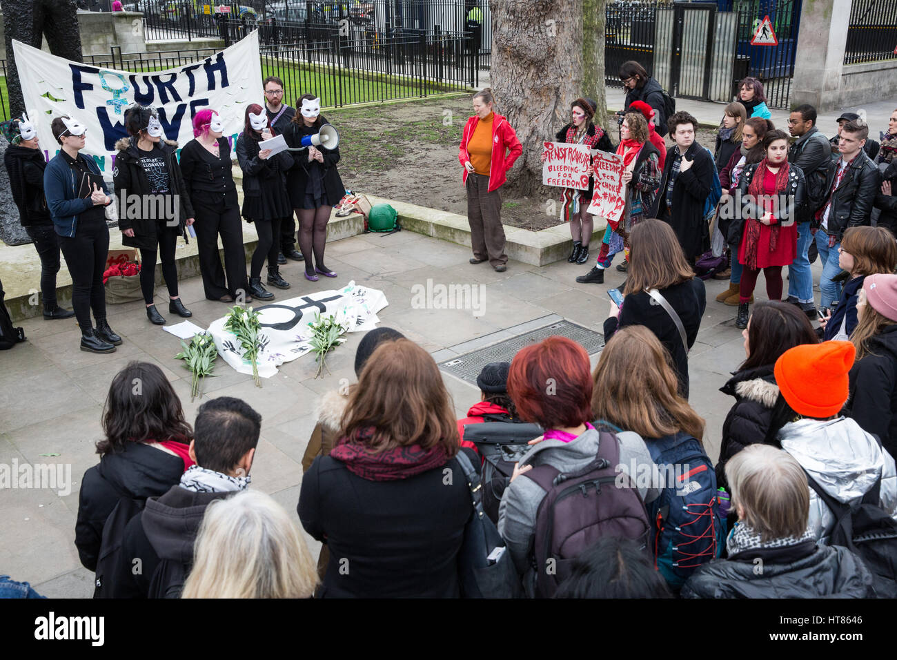 London, UK. 8th March, 2017. Feminist activists from Fourth Wave protest outside Downing Street on International Women's Day to draw attention to the disproportionate impact on women of the Government's continuing programme of austerity cuts. Credit: Mark Kerrison/Alamy Live News Stock Photo