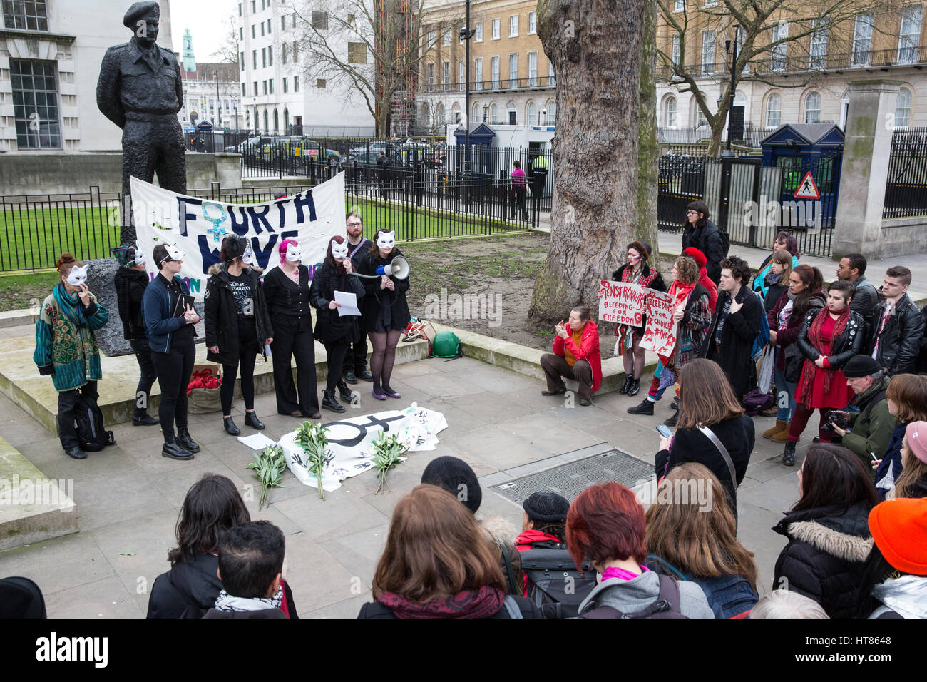 London, UK. 8th March, 2017. Feminist activists from Fourth Wave protest outside Downing Street on International Women's Day to draw attention to the disproportionate impact on women of the Government's continuing programme of austerity cuts. Credit: Mark Kerrison/Alamy Live News Stock Photo