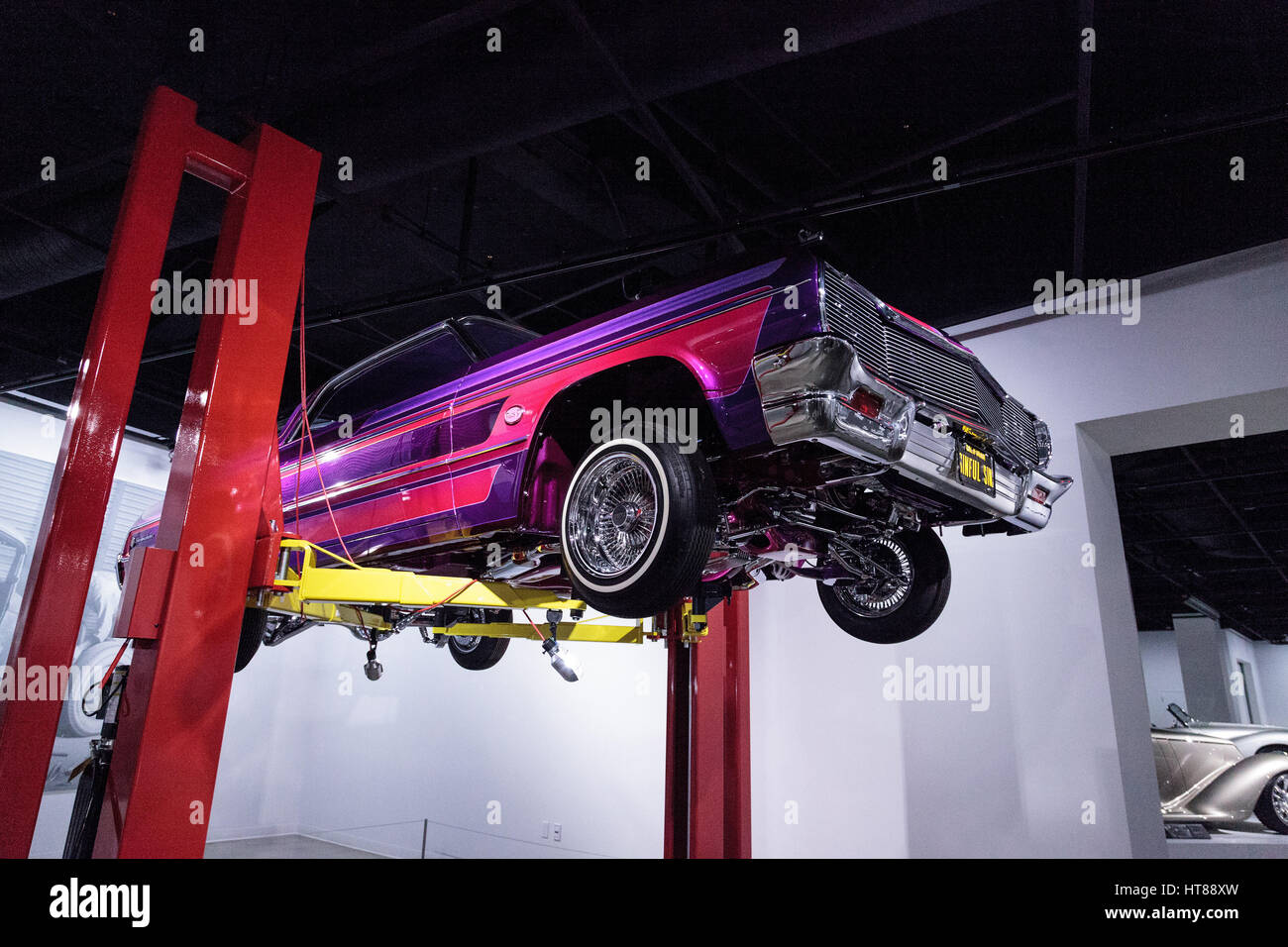 Los Angeles, CA, USA — March 4, 2017: Purple and pink 1964 Chevrolet Impala called Sinful Sin at the Petersen Automotive Museum in Los Angeles, Califo Stock Photo