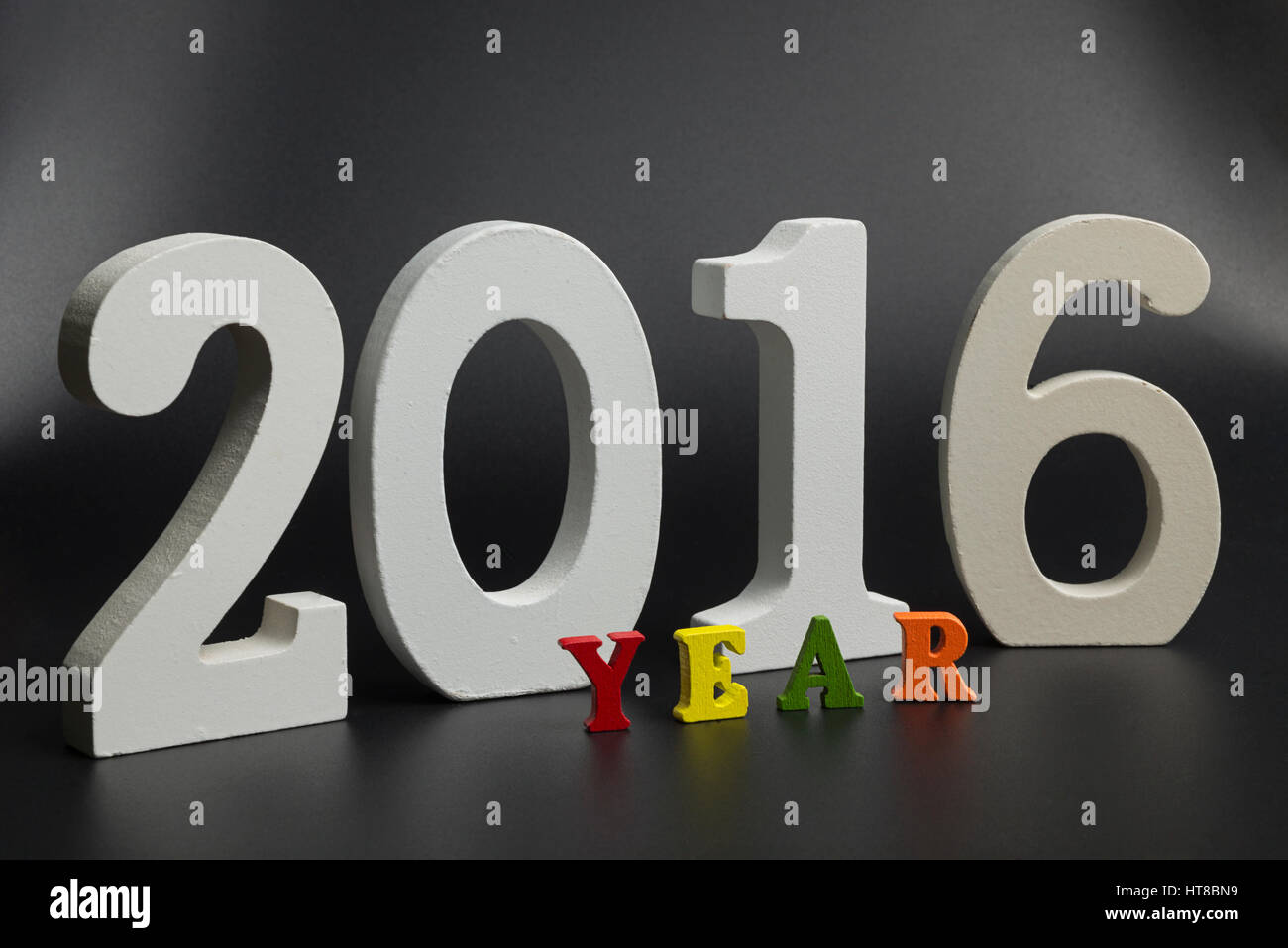 Two thousand sixteen large digits on a black background Stock Photo Alamy