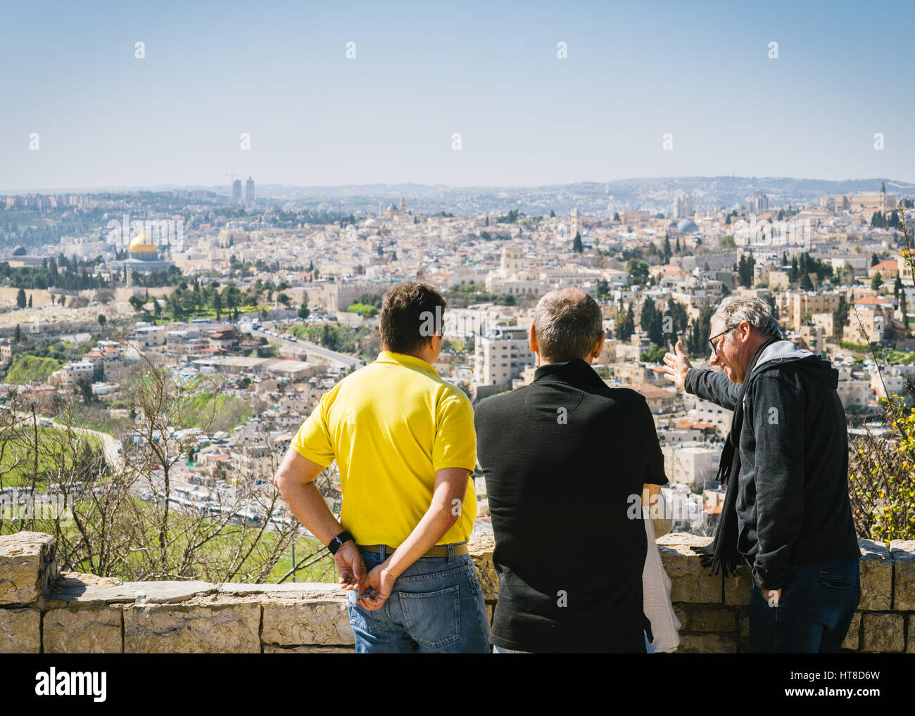 Tourists overlook the panoramic view to Jerusalem Old city and the Temple Mount Stock Photo