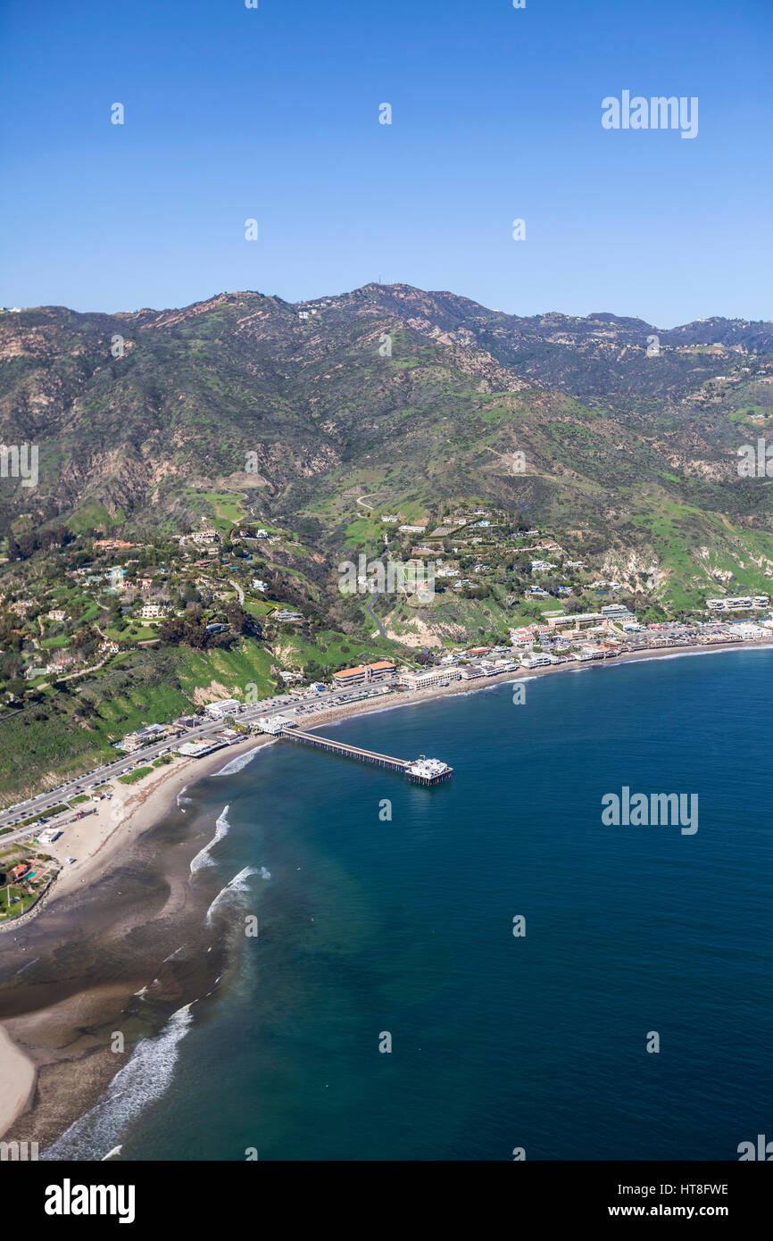 Aerial view of Malibu beaches, homes, pier and Santa Monica Mountains peaks in Southern California. Stock Photo