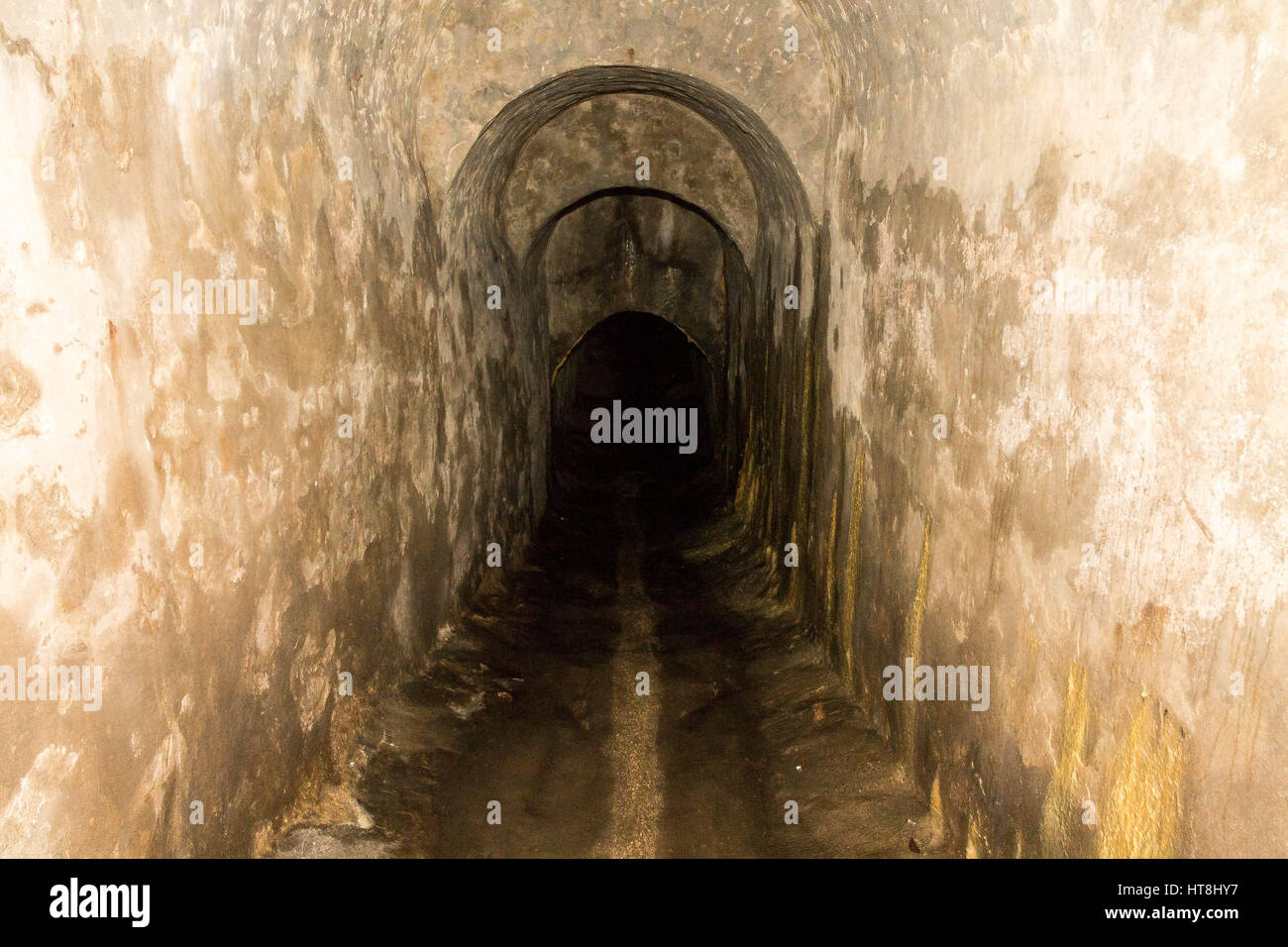 Tunnel for water and rain. Cave, mine. Stock Photo