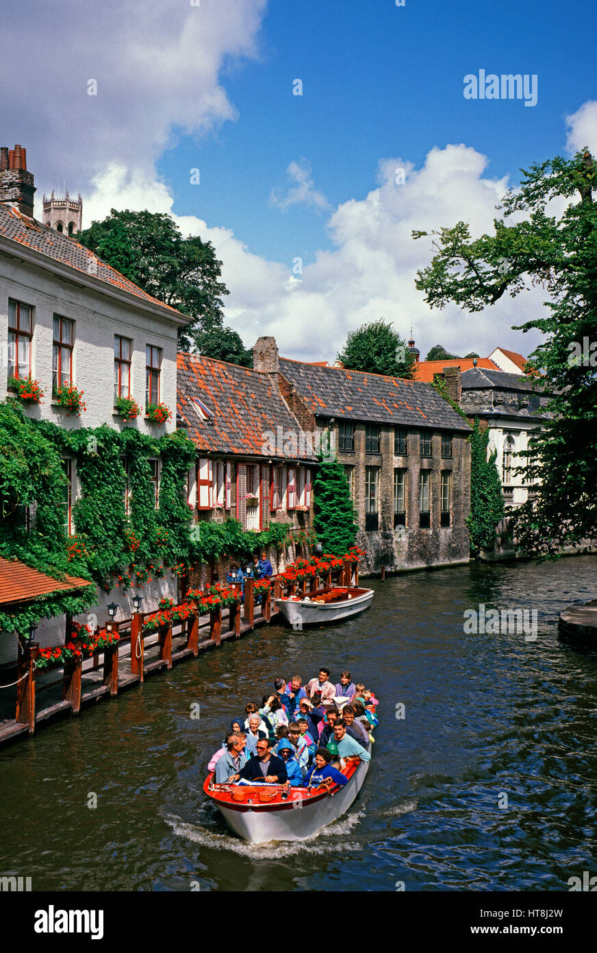 Tourist boat on the Dijver Canal, Bruges, Belgium Stock Photo