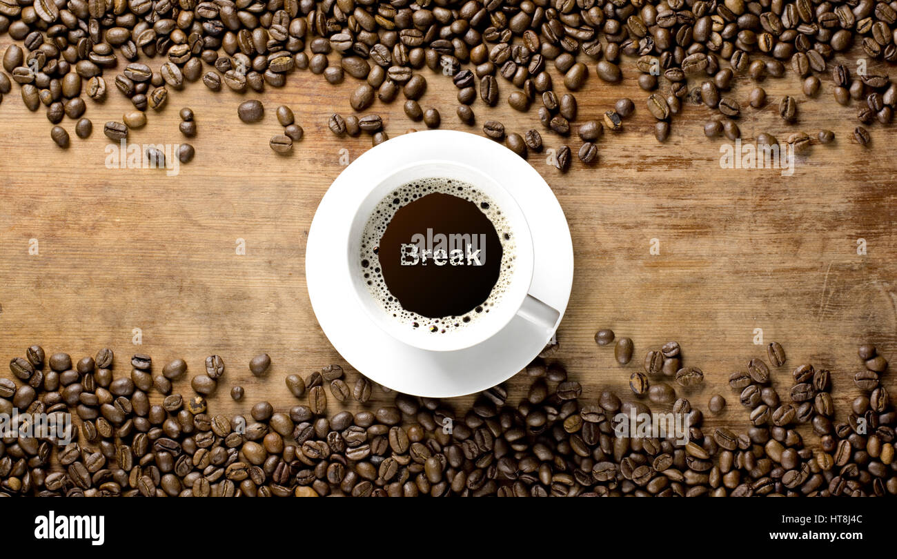 coffee beans background with cup on old rustic table Stock Photo - Alamy