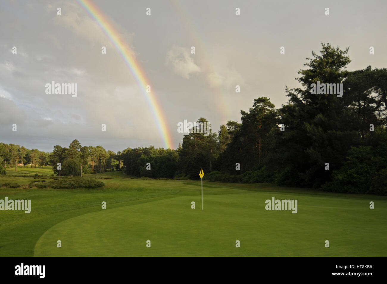 View over the 18th Green to Fairway with Rainbow, West Hill Golf Club, Woking, Surrey, England Stock Photo