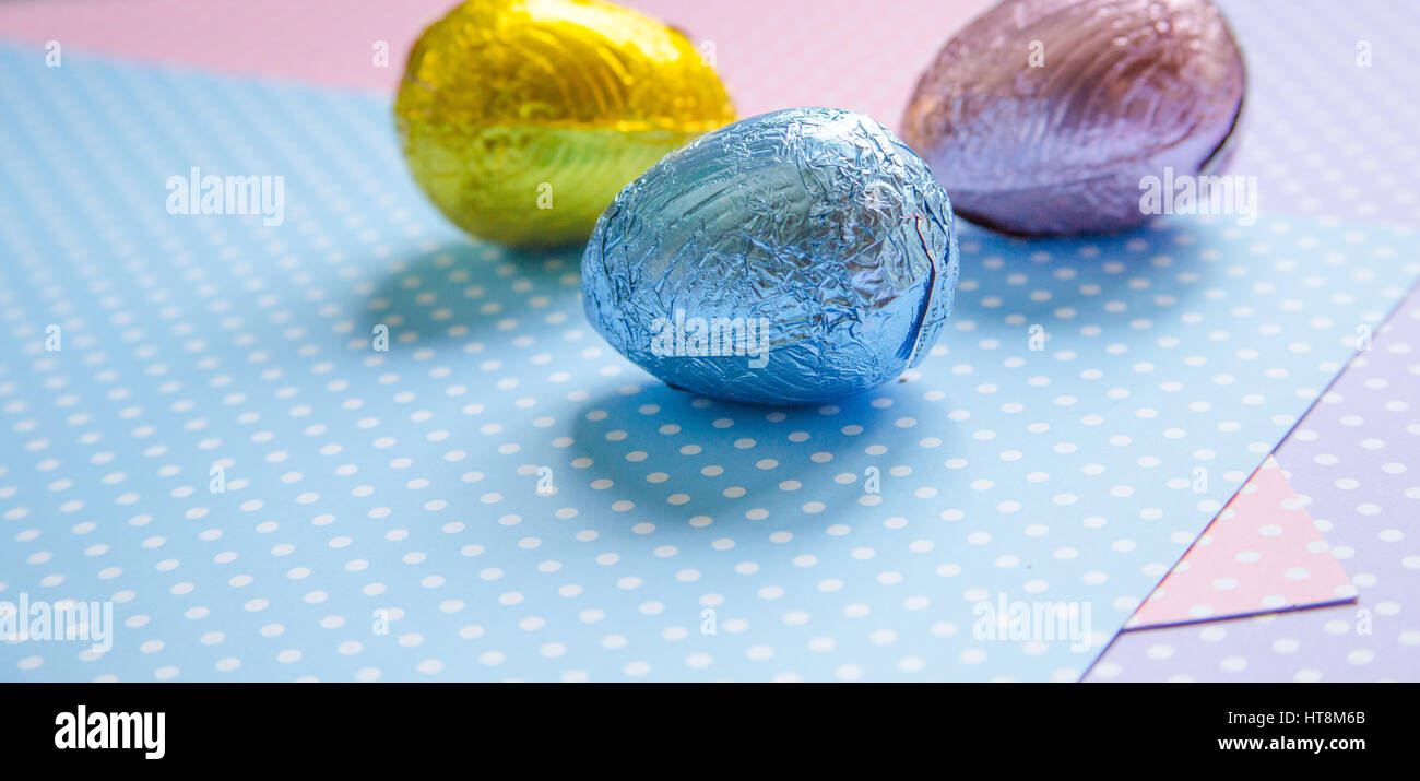Easter eggs wrapped in coloured foil Stock Photo Alamy