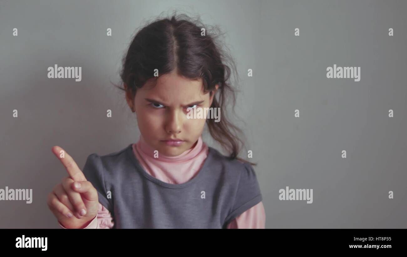 Teen girl shaking her head no finger gesture gesture is not denial