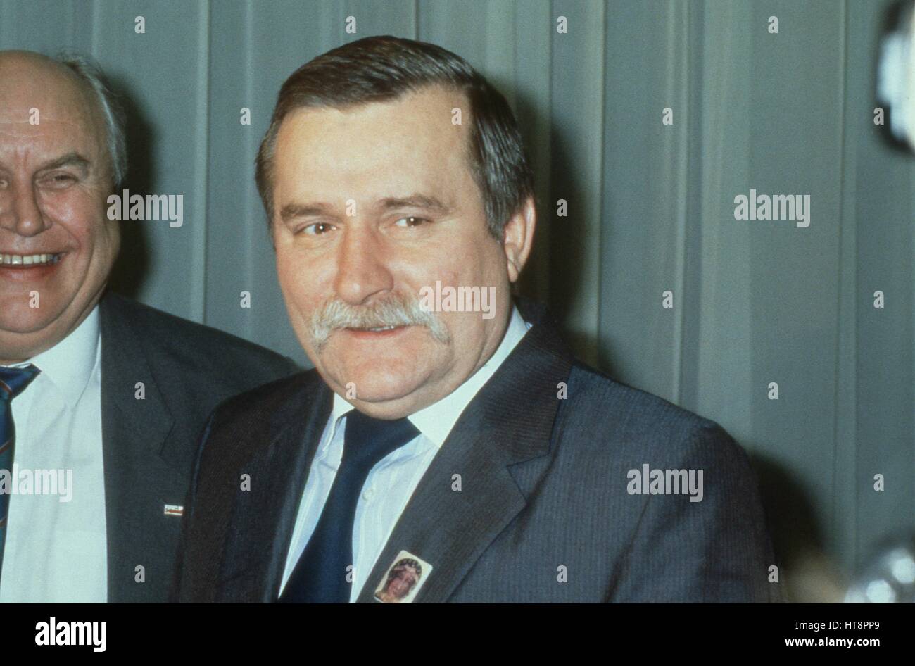 Lech Walesa, President of Poland, attends a press conference at the Trades Union Congress in London, England on November 30, 1989. Norman Willis, General Secretary of the TUC is in the background. Stock Photo