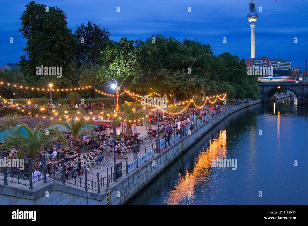 Open air beach bar and dancing in Monbijou park at night, Berlin Stock
