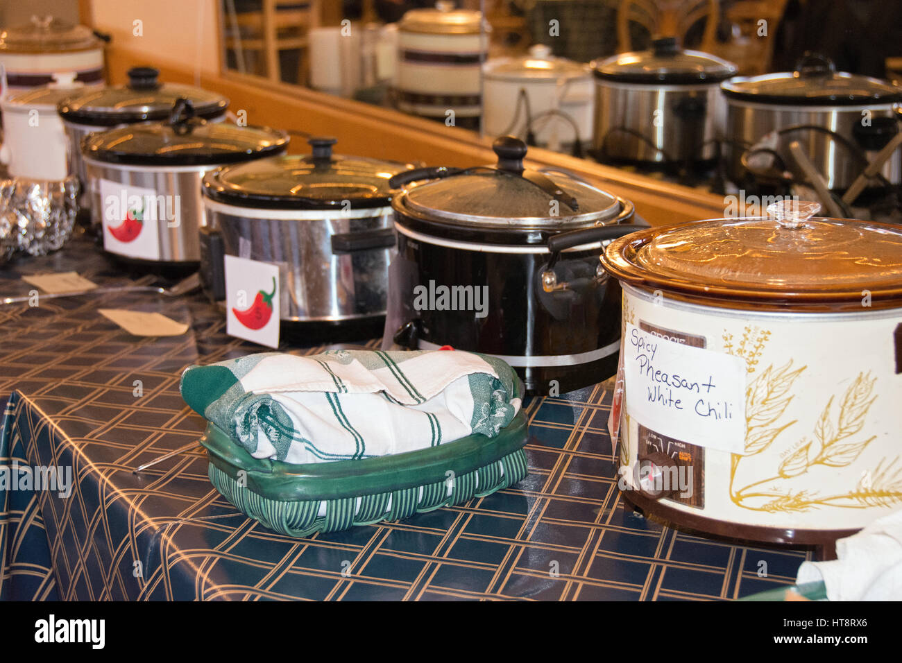 row of crock pots in chili cook-off contest Stock Photo