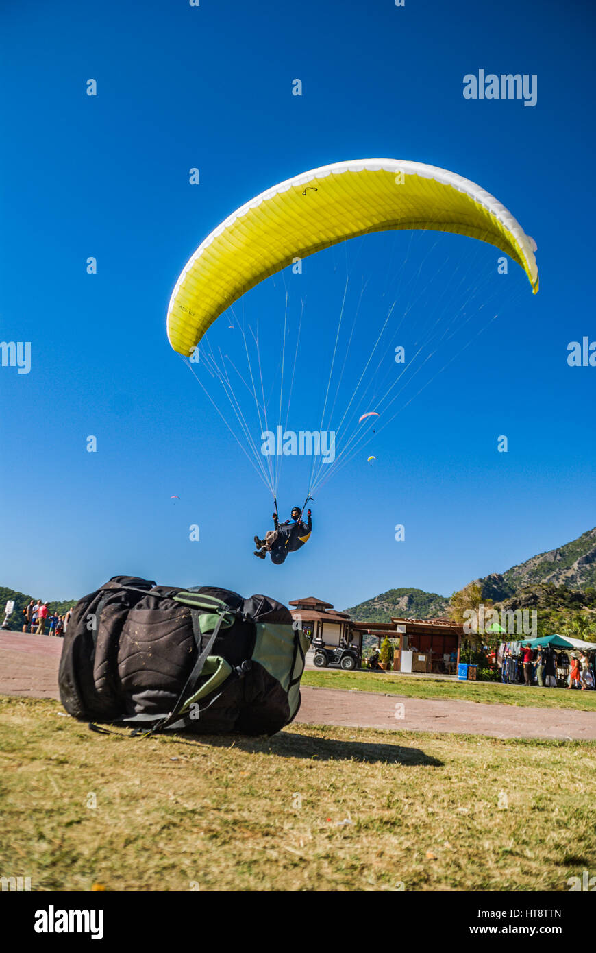 paragliding landing. a photo taken behind the backpack Stock Photo Alamy
