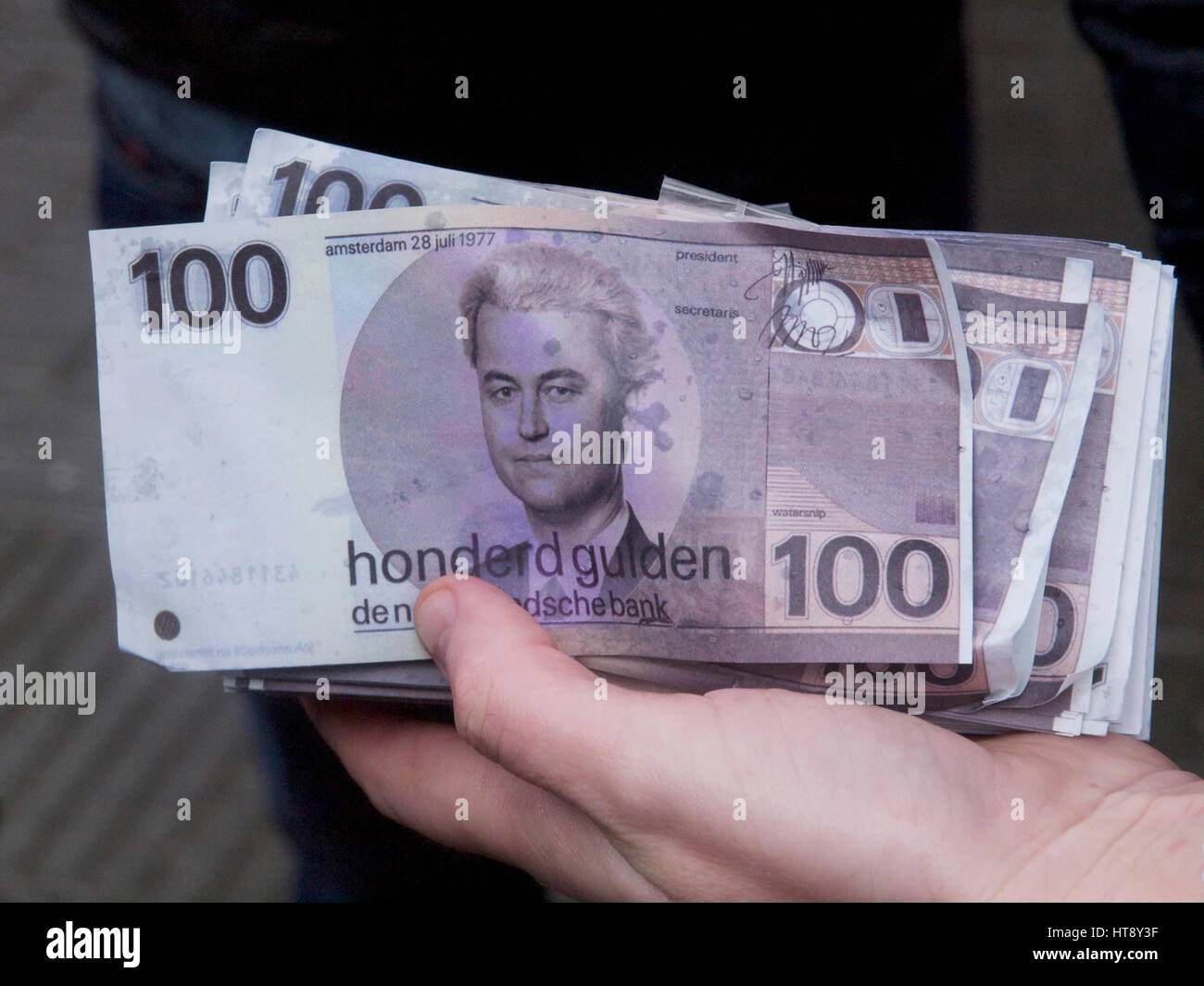 PVV political party flyers, with leader Geert Wilders portrait on a 100 Gulden note, the Dutch currency before the Euro Stock Photo