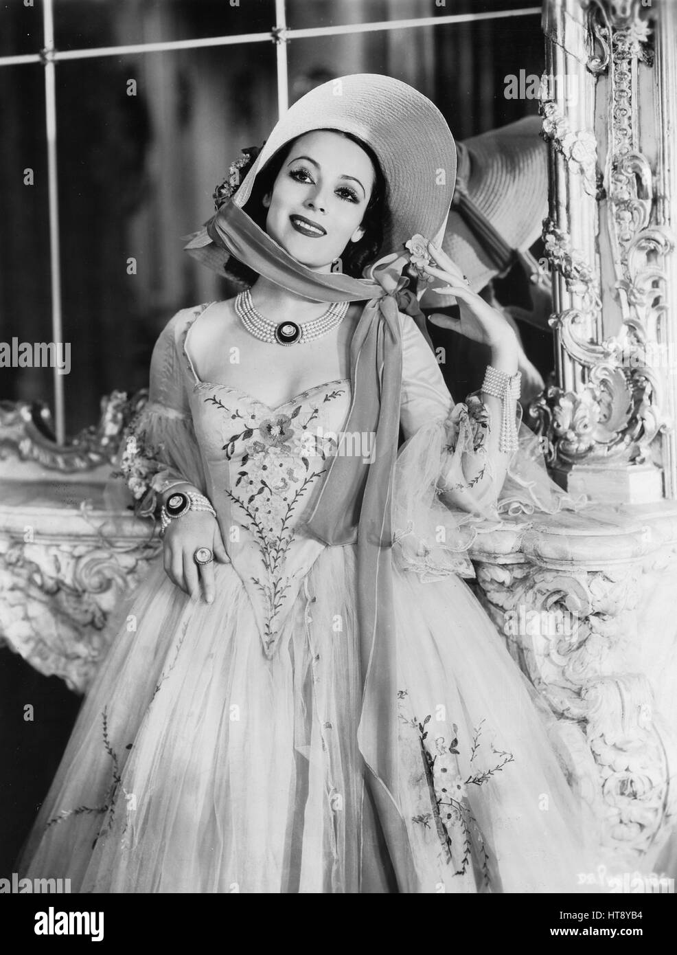 'A beauty with cameos: Dolores Del Rio exquisitely portrays a famous French beauty in the forthcoming Warner picture 'Du Barry.'' Stock Photo