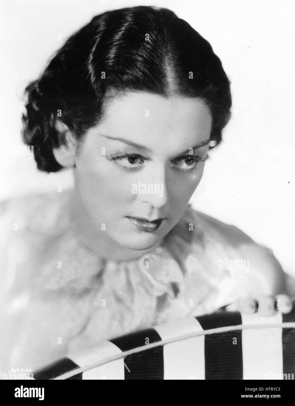 'Lovely Rosalind Russell has climbed faster toward stardom than any other newcomer to the screen. Here she is as she appears in her first important leading role opposite William Powell in Metro-Goldwyn-Mayer's 'Rendezvous.'' Stock Photo