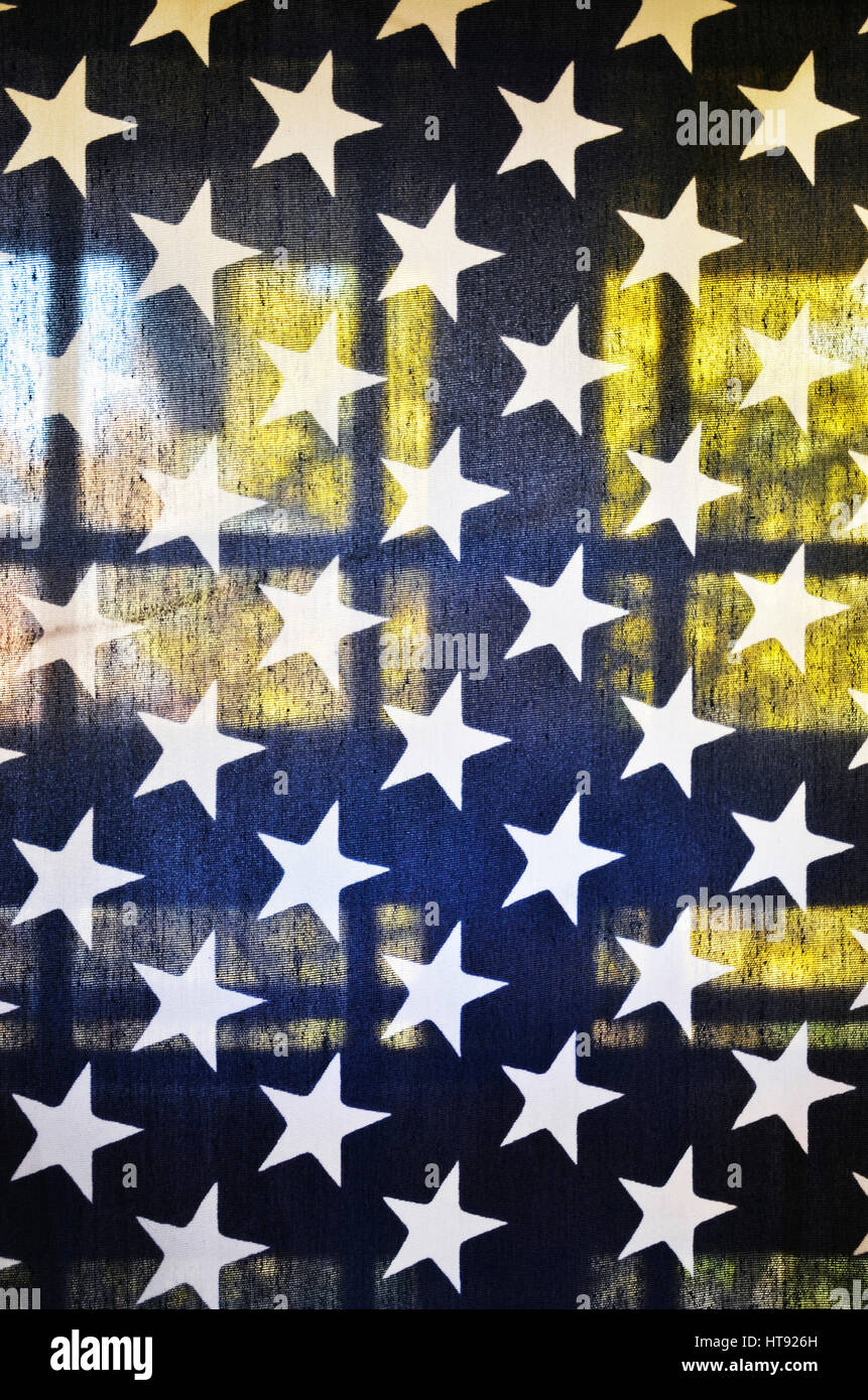 View of translucent American flag on a back porch with window in background Stock Photo
