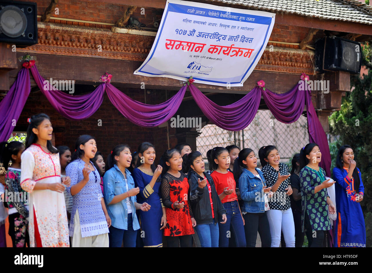 Kathmandu, Nepal. 08th Mar, 2017. Girls from Maiti Nepal sings a song during Maiti Nepal felicitated nine female conductors of Mahanagar Yatayat on 107th International Women's Day at Kathmandu, Nepal on Wednesday, March 08, 2017. Credit: Narayan Maharjan/Pacific Press/Alamy Live News Stock Photo
