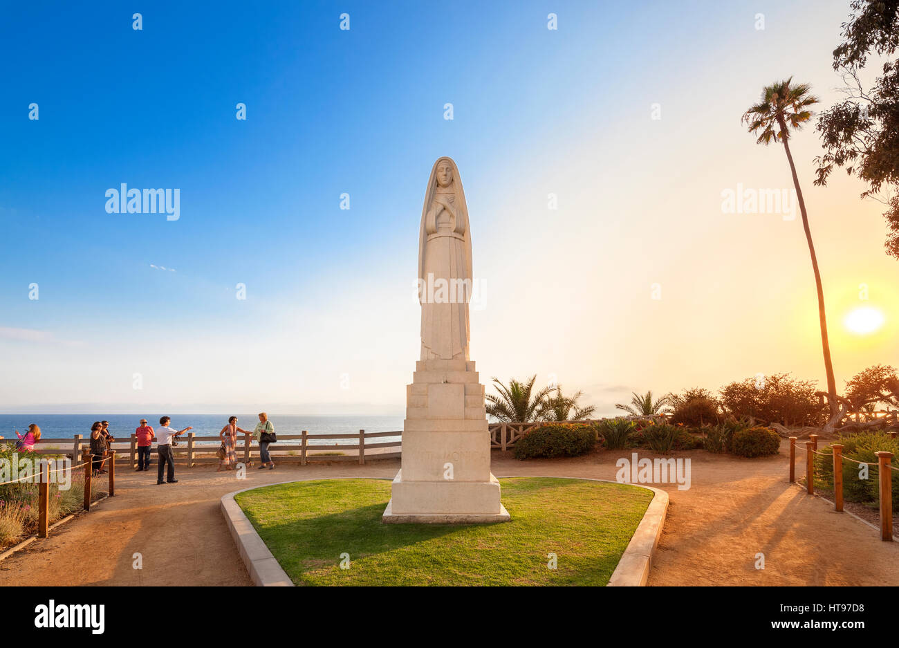 Santa Monica California. Statue of Santa Monica on Ocean Avenue along the beach. At sunset with tourists taking pictures. Stock Photo