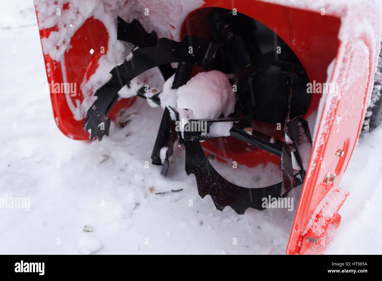 The auger of a snow blower covered in snow after a heavy snowfall. Ontario, Canada Stock Photo