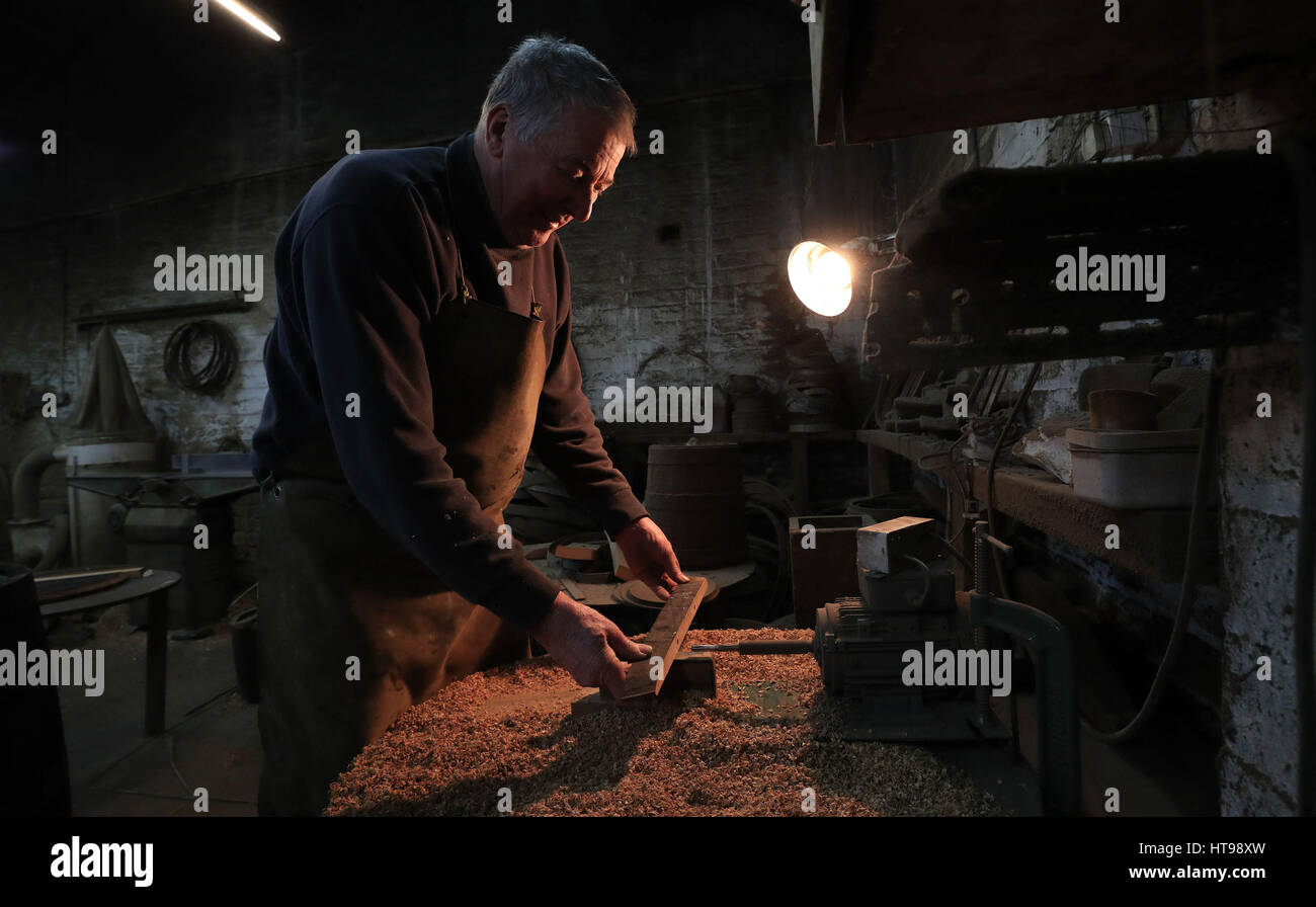 Les Skinner, 72, who is the oldest cooper in England, at his cooperage in Bootle, Liverpool. Stock Photo